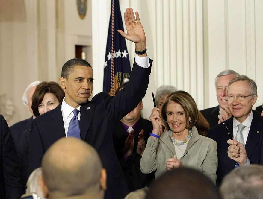 President Obama waves in the East Room of the White House after signing the health care bill on Tuesday. From left: Vicki Kennedy, widow of Sen. Edward Kennedy; the president; House Speaker Nancy Pelosi of Calif.; House Majority Leader Steny Hoyer of Md.; and Senate Majority Leader Harry Reid of Nev. (Associated Press)