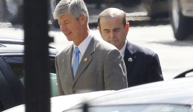 Democrat Reps. Bart Stupak of Michigan (left) and Jerry Costello of Illinois arrive Wednesday at the West Wing of the White House for President Obama&#x27;s closed door signing of an executive order that reaffirms the health care reform law&#x27;s restrictions on the use of federal funds for abortion. (Associated Press)