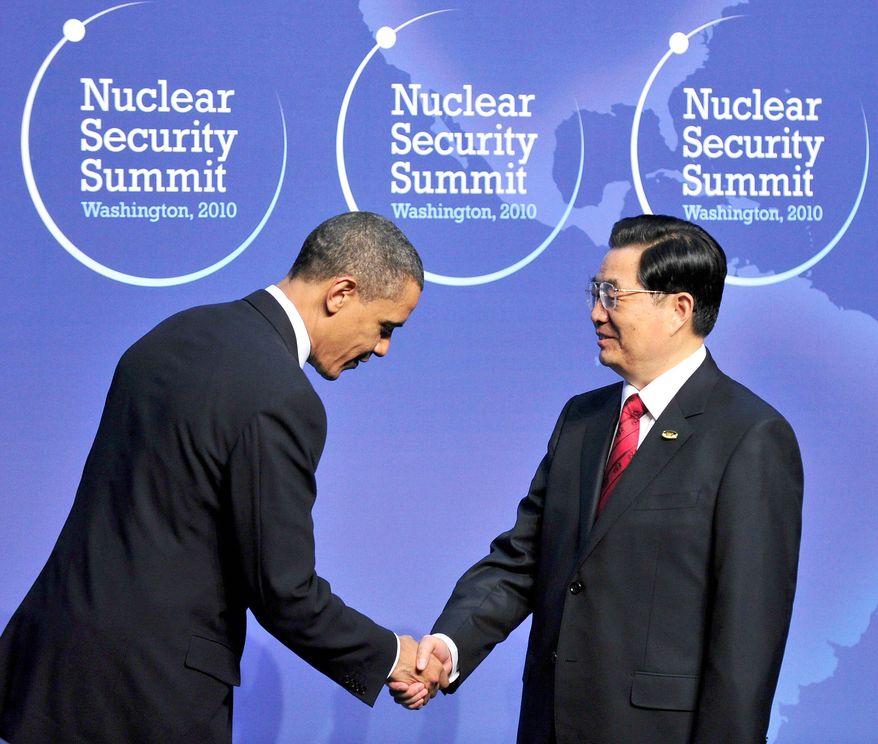 President Obama makes a courtesy bow to welcome Chinese President Hu Jintao to the Nuclear Security Summit in Washington earlier this week. A report by the CIA's Weapons Intelligence, Nonproliferation and Arms Control Center links Chinese companies to nuclear and missile programs in Pakistan and missile programs in Iran. (Bloomberg News)