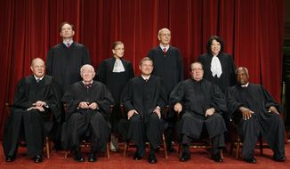 ** FILE ** In this Sept. 29, 2009, file photo, the Supreme Court poses for a portrait at the Supreme Court in Washington. Seated, from left are: Associate Justice Anthony M. Kennedy, Associate Justice John Paul Stevens, Chief Justice John G. Roberts, Associate Justice Antonin Scalia, and Associate Justice Clarence Thomas. Standing, from left are: Associate Justice Samuel Alito Jr., Associate Justice Ruth Bader Ginsburg, Associate Justice Stephen Breyer, and Associate Justice Sonia Sotomayor. Justice John Paul Stevens, the court&#39;s oldest member and leader of its liberal bloc, he is retiring. President Barack Obama now has his second high court opening to fill. (AP Photo/Charles Dharapak. File )