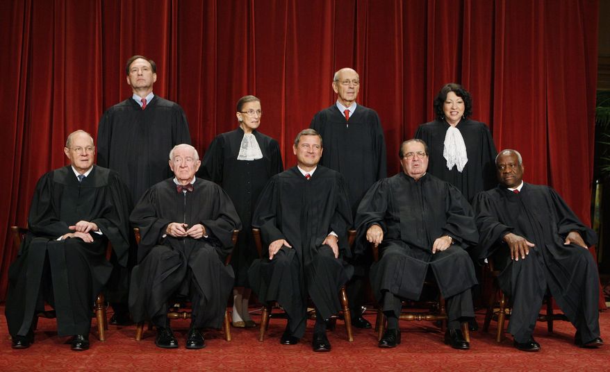 ** FILE ** In this Sept. 29, 2009, file photo, the Supreme Court poses for a portrait at the Supreme Court in Washington. Seated, from left are: Associate Justice Anthony M. Kennedy, Associate Justice John Paul Stevens, Chief Justice John G. Roberts, Associate Justice Antonin Scalia, and Associate Justice Clarence Thomas. Standing, from left are: Associate Justice Samuel Alito Jr., Associate Justice Ruth Bader Ginsburg, Associate Justice Stephen Breyer, and Associate Justice Sonia Sotomayor. Justice John Paul Stevens, the court's oldest member and leader of its liberal bloc, he is retiring. President Barack Obama now has his second high court opening to fill. (AP Photo/Charles Dharapak. File )