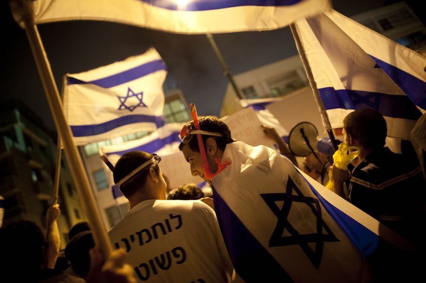 Israelis wearing snorkels attend a demonstration Monday in support of Israel following a deadly raid by Israel's navy on an aid flotilla bound for the blockaded Gaza Strip, outside the Turkish embassy in Tel Aviv, Israel. (Associated Press)