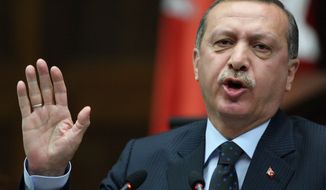 Turkish Prime Minister Recep Tayyip Erdogan addresses lawmakers at the Parliament in Ankara, Turkey, on  Tuesday, June 1, 2010. Mr. Erdogan accused Israel of state terrorism in Monday&#39;s commando raid on a flotilla carrying aid for the Gaza Strip. (AP Photo/Burhan Ozbilici)