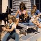 President John F. Kennedy and his family vacation with their pets in this undated photo. From left are daughter Caroline, first lady Jacqueline Kennedy, John Jr. and the president. (AP Photo)