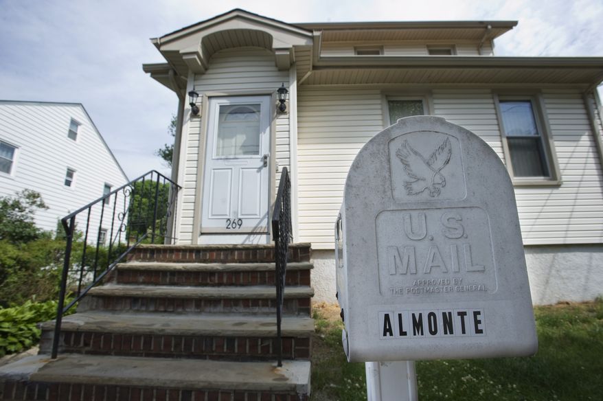 Carlos Eduardo Almonte, one of two men arrested Saturday night at New York's Kennedy Airport on terrorism charges, lived in this house in Elmwood Park, N.J. (AP Photo/Joe Epstein)