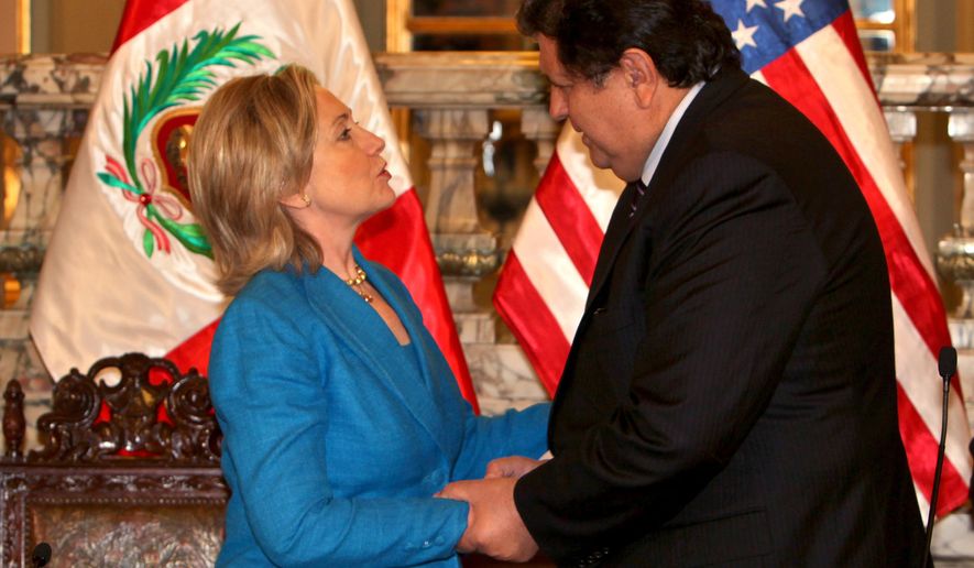Secretary of State Hillary Rodham Clinton greets Peruvian President Alan Garcia during a visit to the Presidential Palace in Lima on Monday, June 7, 2010. Mrs. Clinton is in Peru to attend the 40th general assembly of the Organization of American States. (AP Photo/Dolores Ochoa)
