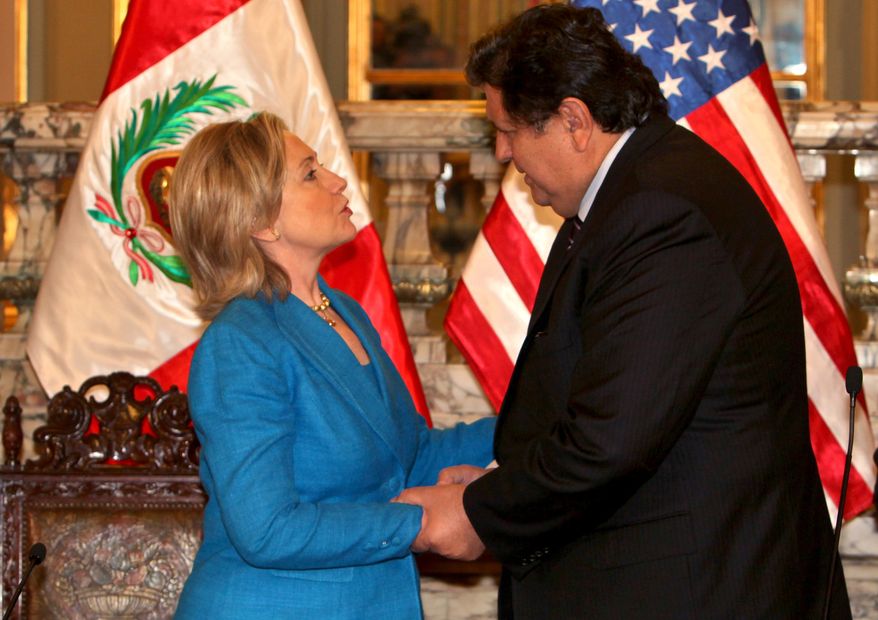 Secretary of State Hillary Rodham Clinton greets Peruvian President Alan Garcia during a visit to the Presidential Palace in Lima on Monday, June 7, 2010. Mrs. Clinton is in Peru to attend the 40th general assembly of the Organization of American States. (AP Photo/Dolores Ochoa)