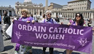 Representatives of the Women&#39;s Ordination Conference stage a protest in front of St. Peter&#39;s Basilica at the Vatican on Tuesday, June 8, 2010. Holding a poster are (from left) Therese Koturbash of Dauphin, Manitoba; Mary Ann Schoettly of Newton, N.J; and Erin Saiz Hanna of Washington. (AP Photo/Pier Paolo Cito)