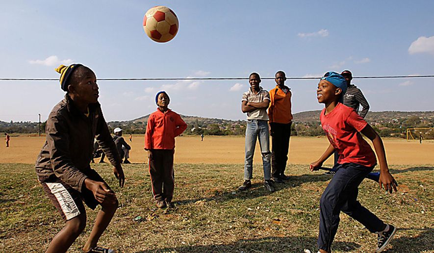 South African youths play at a soccer ground in Rustenburg, South Africa, on Thursday, June 10, 2010. (AP Photo/Lee Jin-man)