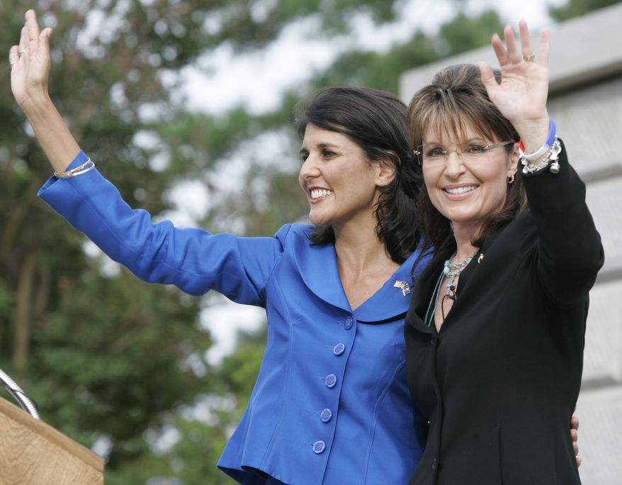 ** FILE ** Former Alaska Gov. Sarah Palin (right) waves to supporters after she endorses South Carolina state Rep. Nikki Haley (left) in the GOP gubernatorial primary race during a campaign rally at the Statehouse in Columbia, S.C., on May 14, 2010. (AP Photo/Mary Ann Chastain, File)