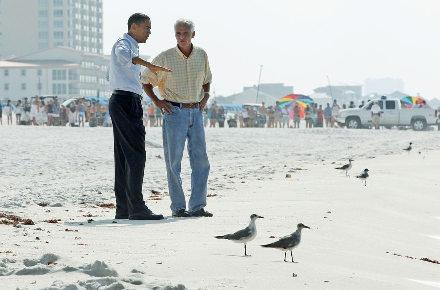 Associated Press
President Obama and Florida Gov. Charlie Crist walk along the beach in Pensacola Beach, Fla., on Tuesday, assessing the risk of damage from the Gulf of Mexico oil spill. The two-day fact-finding trip also took him to Alabama and Mississippi.