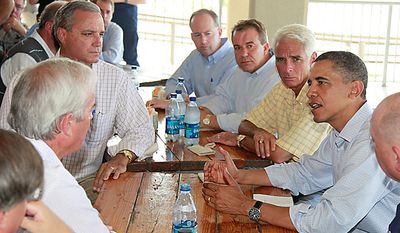 President Obama, flanked by Florida Gov. Charlie Crist, left, National Incident Commander Adm. Thad Allen, right, makes a statement on Pensacola Beach, Fla., Tuesday, June 15, 2010, as they visited the Gulf Coast region affected by the BP Deepwater Horizon oil spill. (AP Photo/Charles Dharapak)