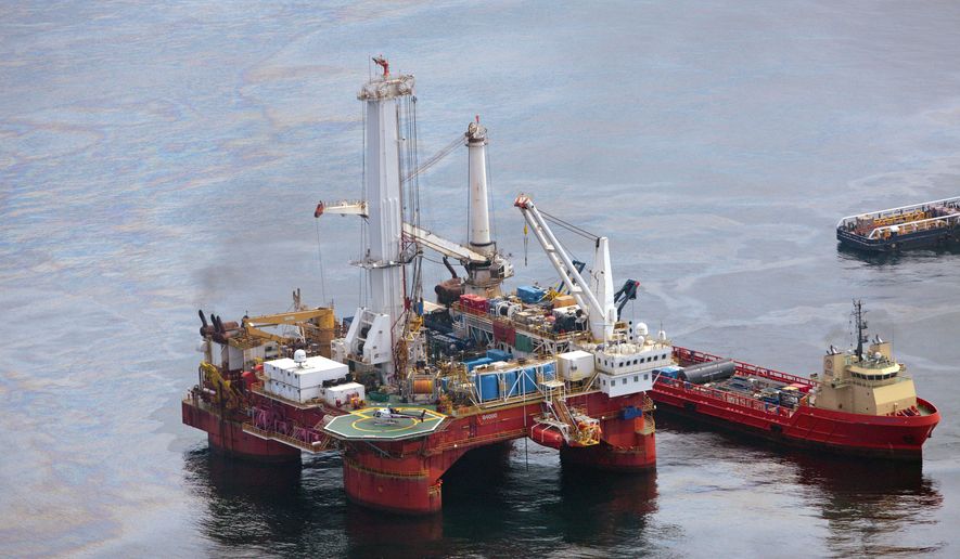 ** FILE ** Vessels operate near the Q4000 drilling rig at the site of the Deepwater Horizon well in the Gulf of Mexico on Sunday, June 13, 2010. (AP Photo/Dave Martin)
