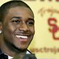 ** FILE ** This Jan. 12, 2006, file photo shows Heisman Trophy winner Reggie Bush announcing at a news conference at the University of Southern California, in Los Angeles, that he will forego his senior year at USC to enter the NFL draft. (AP Photo/Reed Saxon, file)