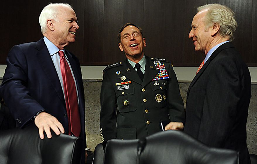 Army Gen. David H. Petraeus, commander, U.S. Central Command, talks with Sen. John McCain, Arizona Republican (left) and Sen. Joseph I. Lieberman, Connecticut Independent, (right) prior to testifying before the Senate Armed Services Committee on the situation in Afghanistan on Capitol Hill in Washington on June 16, 2010. The hearing is continued from Tuesday when Gen. Petraeus slumped briefly during testimony, which aides blamed on dehydration and jet lag. (UPI/Roger L. Wollenberg)