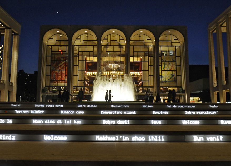 ** FILE ** In this file photo of Thursday, May 20, 2010, the Metropolitan Opera House, center, is seen behind a newly rebuilt fountain at Lincoln Center for the Performing Arts in New York. The Metropolitan Opera suffered through an ignoble fiscal year in 2009. (AP Photo/Henny Ray Abrams, file)