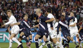 Players watch the ball heading into the net for a goal by United States&#x27; Maurice Edu, second right, that was later disallowed during the World Cup group C soccer match between Slovenia and the United States at Ellis Park Stadium in Johannesburg, South Africa, Friday, June 18, 2010. (AP Photo/Luca Bruno)