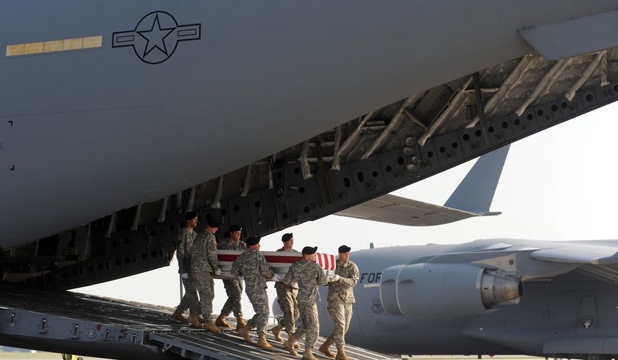 An Army carry team carries a transfer case containing the remains of Pfc. Benjamin J. Park Sunday, June 20, 2010, at Dover Air Force Base, Del. According to the Department of Defense, Park, of Fairfax Station, Va., died while supporting Operation Enduring Freedom. (AP Photo/Steve Ruark)
