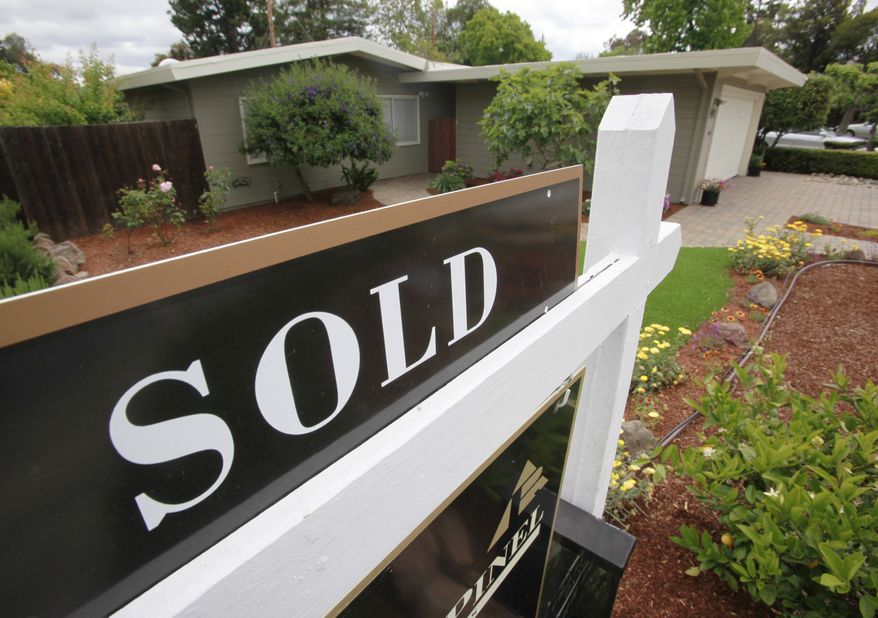 A house in Palo Alto, Calif., sports a "sold" sign on Monday, May 24, 2010. Sales of previously occupied homes dipped 2.2 percent in May, suggesting that a boost from government home-buying incentives is winding down earlier than expected. (AP Photo/Paul Sakuma)