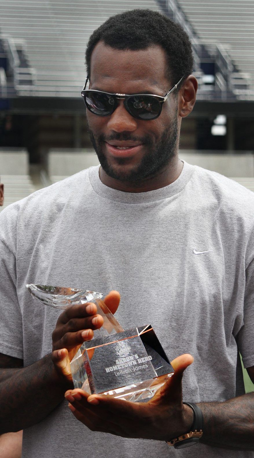 Cleveland Cavaliers forward LeBron James gets a Hometown Hero award from the city of Akron during the "LeBron Appreciation Day" on Saturday.