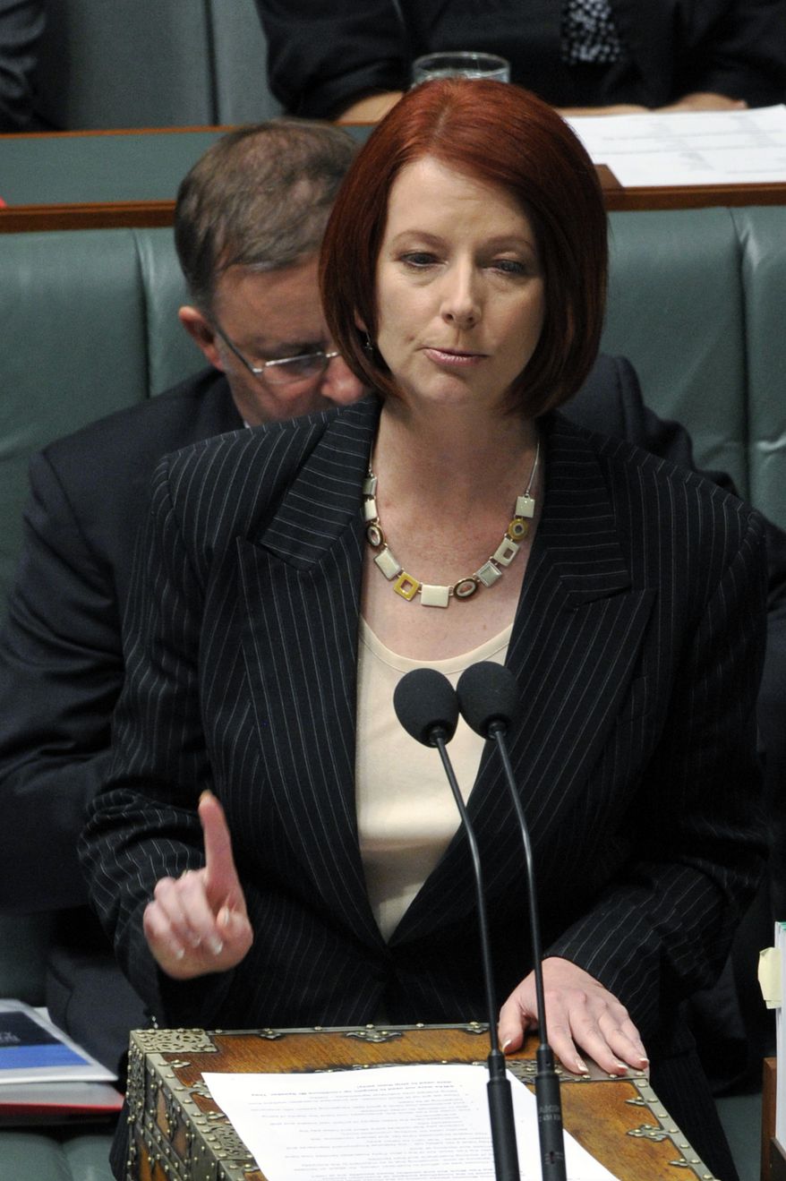 Australia's first female prime minister, Julia Gillard, speaks during a House of Representatives question time at Parliament House in Canberra, Australia, Thursday, June 24, 2010. Ms. Gillard was sworn in leader after the ruling Labor Party ousted Prime Minister Kevin Rudd. (AP Photo/AAP Image, Alan Porritt)