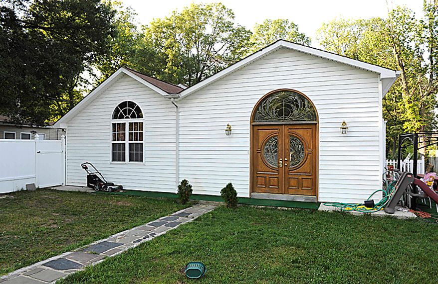 The home of Umar Farooq in Alexandria, Va., Thursday, June 24, 2010, Farooq was one of the five American men convicted Thursday on terror charges by a Pakistan court and sentenced to 15 years in prison each, a prosecutor said. The judge handed down two prison terms for each man, one for 10 years and the other for five, said deputy prosecutor Rana Bakhtiar. (AP Photo/Cliff Owen)
