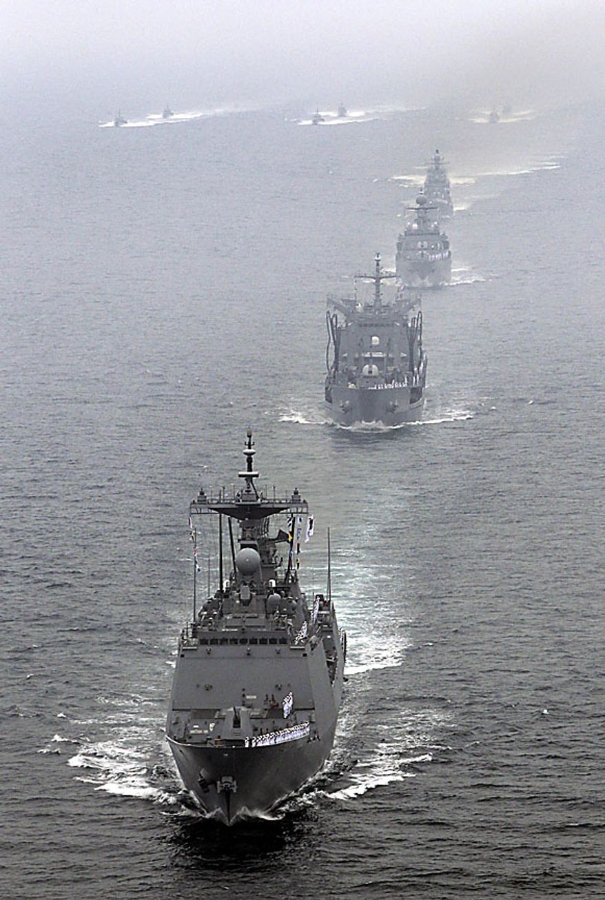 South Korean Navy warships parade off southeastern coast near Busan, South Korea, to mark the 60th anniversary of the Korean War on Friday, June 25, 2010. The two Koreas commemorated the anniversary Friday of the outbreak of the war, promoting vastly different views of the origins of the conflict that still divides their peninsula a full six decades later. (AP Photo/Yonhap, Jo Jung-hoo)