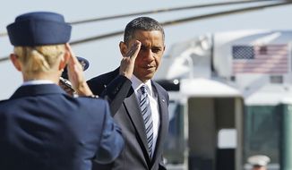 President Obama returns a salute prior to boarding Air Force One at Andrews Air Force Base, Md., Friday, June 25, 2010, prior to traveling to Canada for the G-20 summit. (AP Photo/Charles Dharapak)