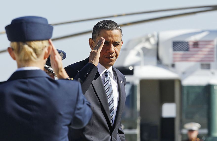 President Obama returns a salute prior to boarding Air Force One at Andrews Air Force Base, Md., Friday, June 25, 2010, prior to traveling to Canada for the G-20 summit. (AP Photo/Charles Dharapak)