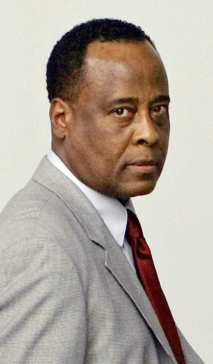 In this Monday, Feb. 8, 2010 file photo, Michael Jackson's physician, Conrad Murray arrives for his arraignment at the Airport Branch Courthouse in Los Angeles. Attorneys for the doctor charged in Michael Jackson's death say they've reached a deal with Nevada prosecutors on a child support claim, and Dr. Conrad Murray's state medical license won't be revoked. (AP Photo/Damian Dovarganes, FILE)