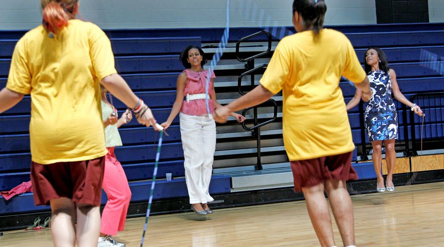 First lady Michelle Obama jumps rope Wednesday with students in Washington, D.C. Mrs. Obama&#39;s &quot;Let&#39;s Move&quot; initiative aims to increase awareness and decrease the rate of obesity. (Associated Press)