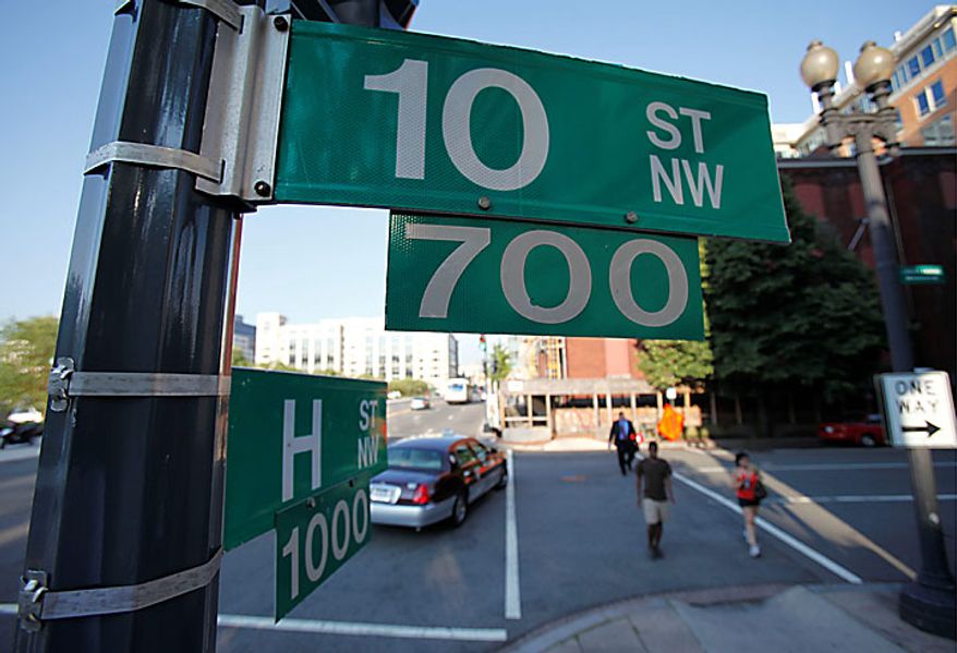 The intersection of 10th and H Street NW in Washington, Monday, June 28, 2010. According to court papers, an undercover FBI agent posing as a Russian agent met with Mikhail Semenko at this Washington location. Ten people have been arrested for allegedly serving as secret agents of the Russian government with the goal of penetrating U.S. government policymaking circles. (AP Photo/Pablo Martinez Monsivais)