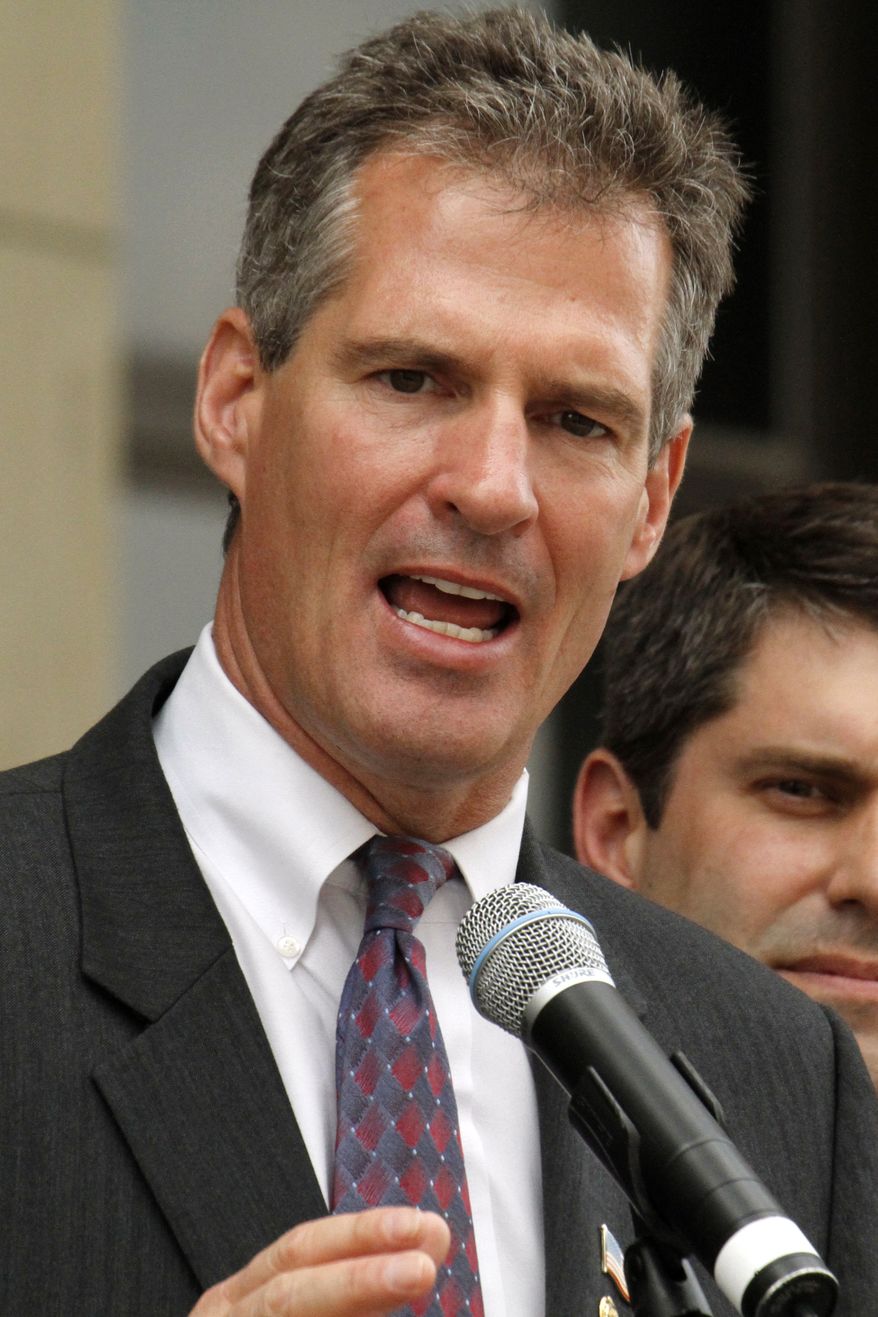 ** FILE ** Sen. Scott Brown, Massachusetts Republican, speaks on the steps of the Washington County Courthouse in Washington, Pa., on May 14, 2010. (AP Photo/Gene J. Puskar, File)