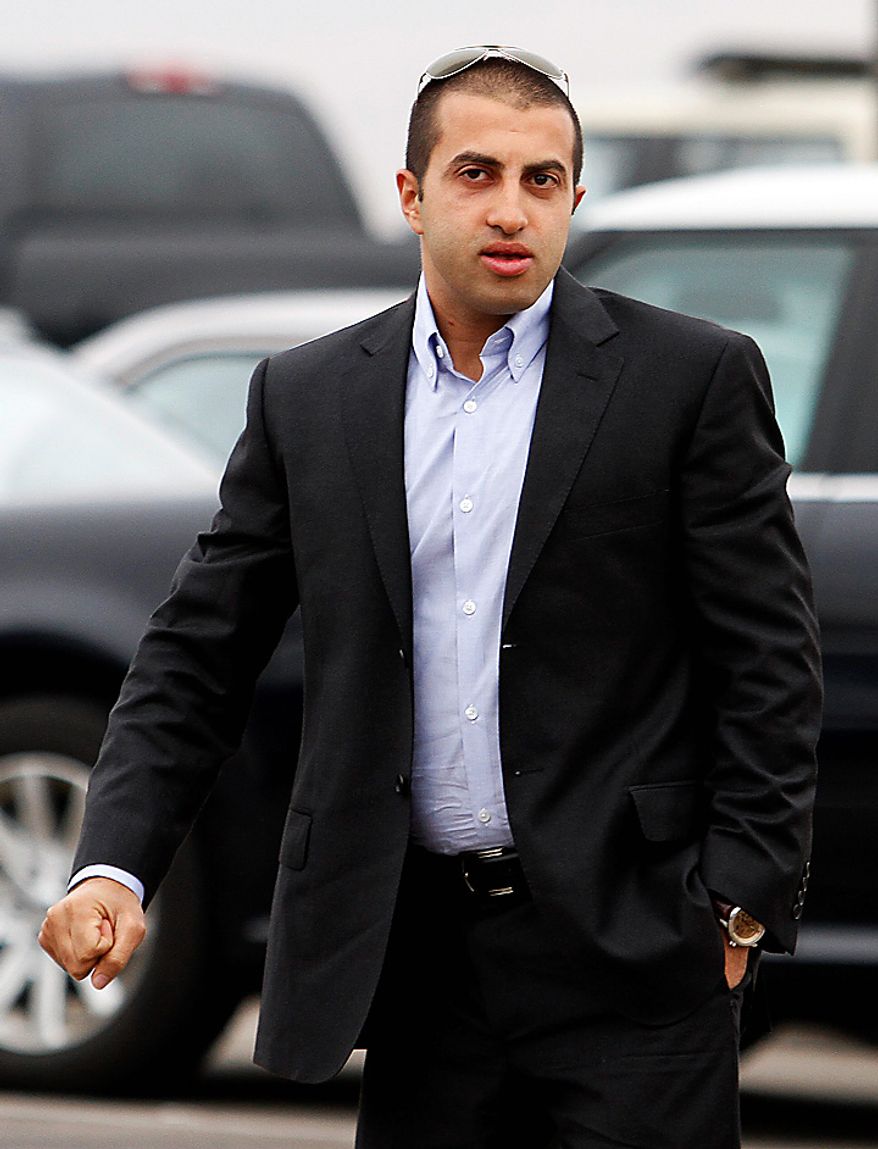 Mosab Hassan Yousef walks into his deportation hearing held at the immigration detention center in San Diego Wednesday, June 30, 2010. Yousef says he will be killed if he is deported from the United States to the West Bank. The oldest son of one of Hamas' founders, he was an Israeli spy for a decade, and he abandoned Islam for Christianity, further marking him a traitor. (AP Photo/Denis Poroy)