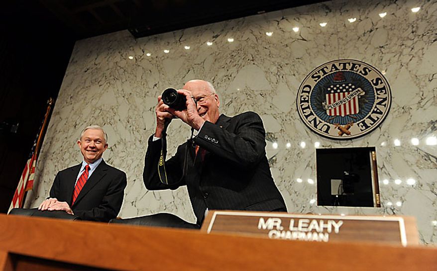 Committee Chair Sen. Patrick J. Leahy, Vermont Democrat, takes a photo as ranking member Sen. Jeff Sessions, Alabama Republican, smiles as they wait for Supreme Court nominee Elena Kagan, President Obama&#39;s pick to replace retiring Justice John Paul Stevens, to testify on the third day of her confirmation hearing before the Senate Judiciary Committee on Capitol Hill in Washington on June 30, 2010.    UPI/Roger L. Wollenberg