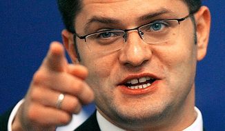 Serbian Foreign Minister Vuk Jeremic gestures during a press conference in Bucharest, Romania, Tuesday, Sept. 4, 2007. (AP Photo/Vadim Ghirda)