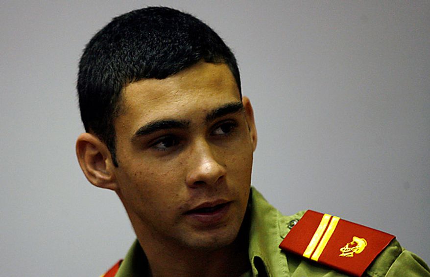 In this April 3, 2010 photo, Elian Gonzalez attends the Union of Young Communists congress in Havana. Gonzalez was at the center of an international custody battle 10 years ago when federal agents stormed the Miami home of his father's relatives on April 22, 2000, putting him on a path back to his father in Cuba. Fisherman found Gonzalez floating in an inner tube in the waters off Fort Lauderdale on Thanksgiving 1999 as he was traveling with his mother who drowned trying to reach the U.S. (AP Photo/Ismael Francisco, Prensa Latina)