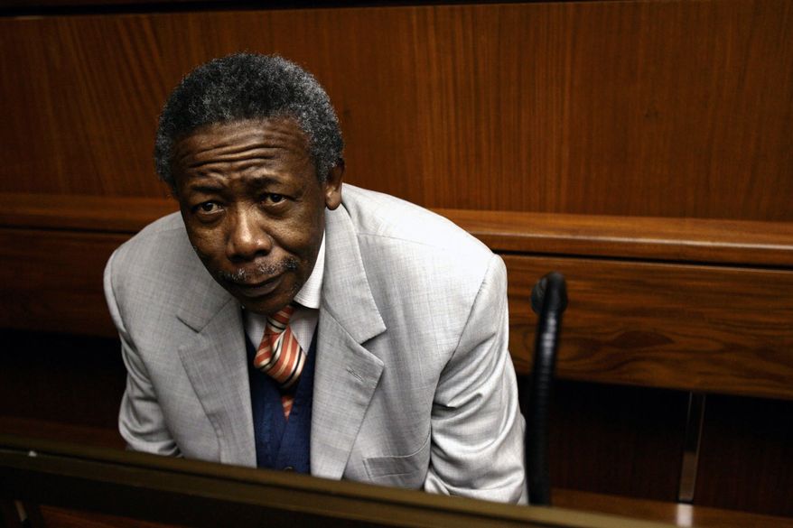 Former South African National Police Commissioner Jackie Selebi, inside the Johannesburg High Court, in Johannesburg Friday, July 2, 2010. He was convicted of corruption Friday after a nation beset by crime heard months of testimony about its top cop going on designer shopping sprees with a convicted drug smuggler. (AP Photo/Werner Beukes, Pool)