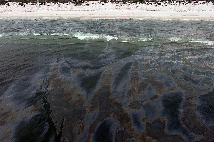 A huge oil slick approaches the beach at the state park in Gulf Shores, Ala., Friday, July 2, 2010. Oil from the Deepwater Horizon incident is expected to come ashore over the July 4th weekend. (AP Photo/Dave Martin)