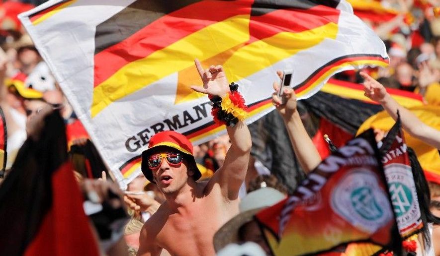 Fans of Germany&#39;s soccer team show their pride in Berlin before the quarterfinal World Cup match between Argentina and Germany on Saturday. (Associated Press)