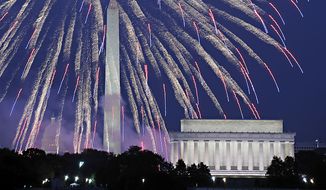 **FILE** Fireworks explode over Washington as the United States celebrates its 234th birthday on Sunday, July 4, 2010. Seen from left is the U.S. Capitol, Washington Monument and Lincoln Memorial. (AP Photo/Cliff Owen)
