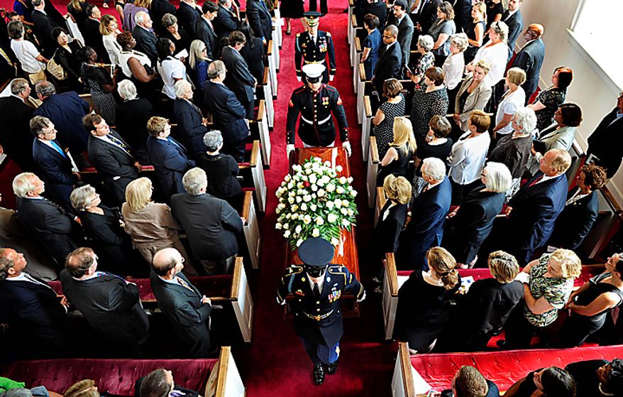 A military honor guard escorts the casket of Sen. Robert Byrd, Tuesday, July 6, 2010, after a funeral service at the Memorial Baptist Church in Arlington, Va. (AP Photo/Linda Davidson, Pool)