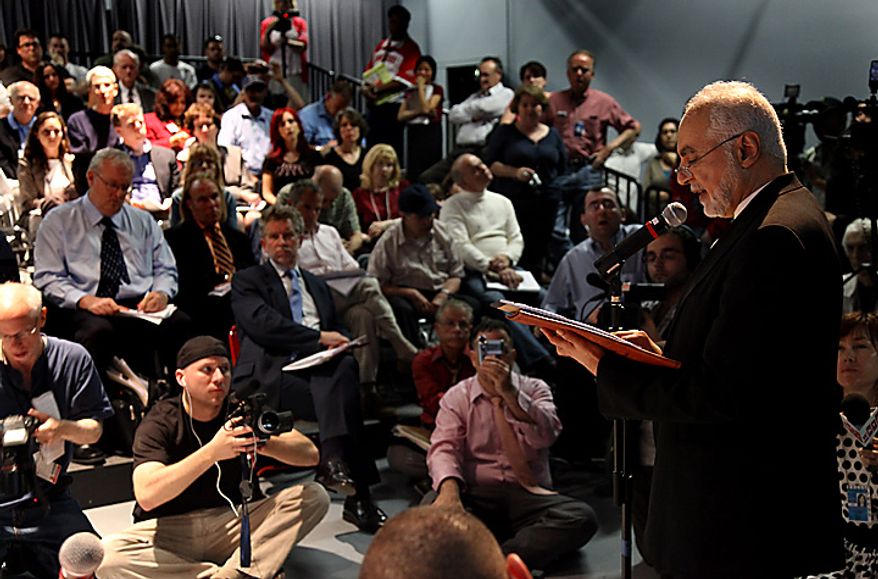 Imam Feisal Abdul Rauf, executive director of the Cordoba Initiative, addresses a gathering as groups planning a proposed mosque and cultural center near Ground Zero in Lower Manhattan to be named Cordoba House showed and spoke about their plans for the center at a community board meeting in New York Tuesday, May 25, 2010. Community members both for and against the plan spoke during the meeting. (AP Photo/Craig Ruttle)