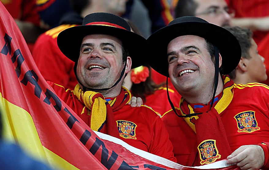 Spain supporters wait for the start of the World Cup semifinal soccer match between Germany and Spain at the stadium in Durban, South Africa, Wednesday, July 7, 2010. (AP Photo/Luca Bruno)
