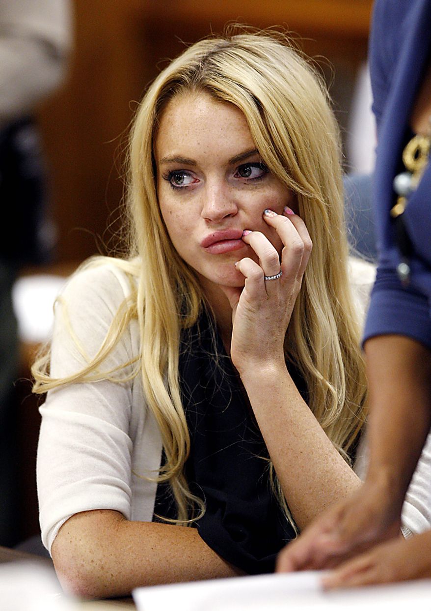 Actress Lindsay Lohan reacts following her sentencing by Superior Court Judge Marsha Revel during a probation status hearing in Beverly Hills, California on July 6, 2010. Revel sentenced Lohan to 90 days in jail Tuesday after ruling she violated probation in a 2007 drug case by failing to attend court-ordered alcohol education classes. UPI/David McNew/Pool