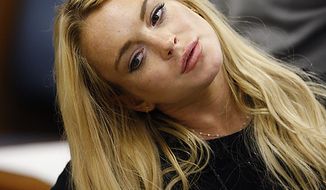 Actress Lindsay Lohan appears in court during a probation status hearing relating to her August 2007 no contest pleas to two counts each of DUI and being under the influence of cocaine, along with a reckless driving charge, at the Beverly Hills Municipal Courthouse, in Beverly Hills, California on July 6, 2010.      UPI/David McNew/Pool