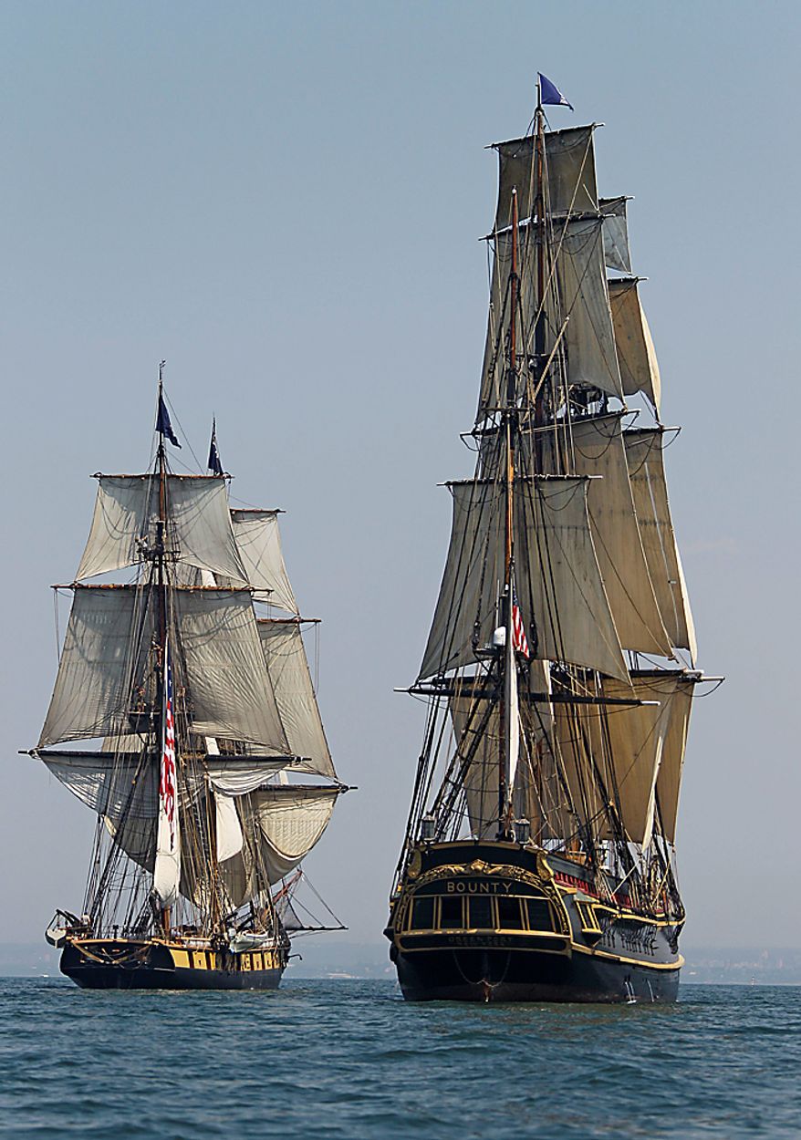 The HMS Bounty, right, and USS Niagara sail the waters of Lake Erie off Cleveland Wednesday, July 7, 2010. Eleven sailing ships will be in the city for the annual tall ships festival. (AP Photo/Mark Duncan)