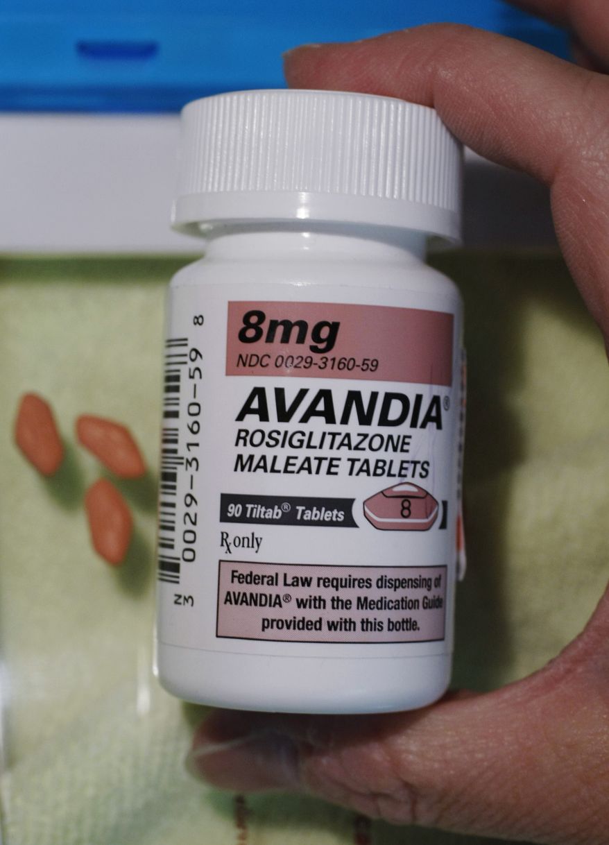 A pharmacist holds a bottle of Avandia pills at Maximart Pharmacy in Palo Alto, Calif., on Wednesday, June 30, 2010. (AP Photo/Paul Sakuma)