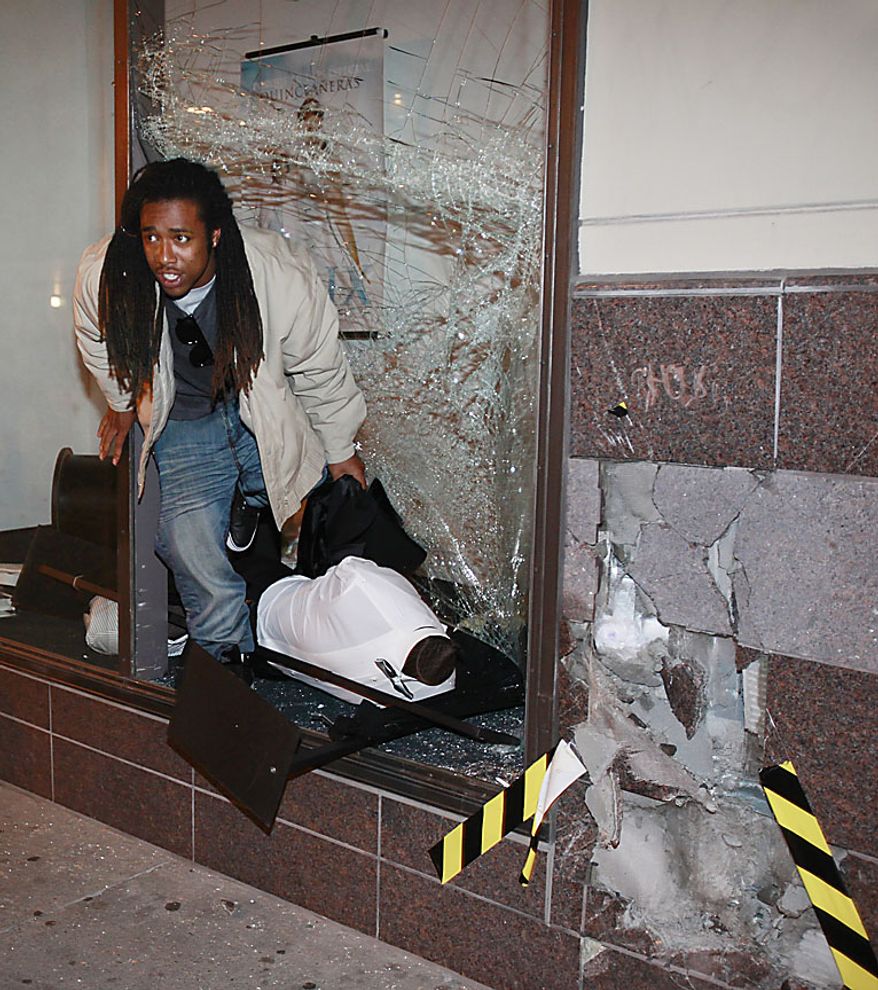 A demonstrator takes a mannequin after breaking the window at a downtown Sears store during a protest in Oakland, Calif., after a guilty verdict for Johannes Mehserle, Thursday, July 8, 2010. Former San Francisco Bay Area Rapid Transit police officer Johannes Mehserle was found guilty in Los Angeles for shooting unarmed black man Oscar Grant on New Year's Day 2009 at a BART station in Oakland. (AP Photo/Paul Sakuma)