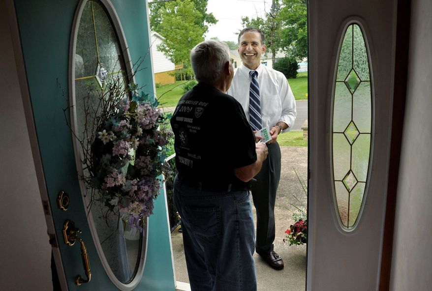 Mr. Arcuri chats with a constituent while canvassing door to door in Utica, N.Y. Mr. Arcuri is one of the Democrats struggling for political survival in an economically ailing area.